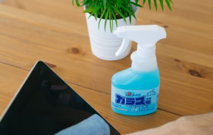 Wiping and sanitizing a desk surface during office cleaning